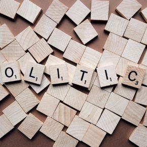 scrabble tiles forming the word 'politics'